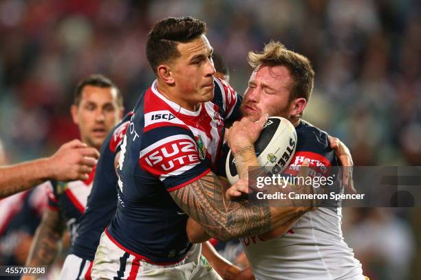 Gavin Cooper of the Cowboys is tackled during the 1st NRL Semi Final match between the Sydney Roosters and the North Queensland Cowboys at Allianz...