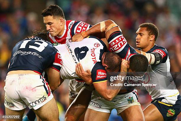 Matt Scott of the Cowboys is tackled during the 1st NRL Semi Final match between the Sydney Roosters and the North Queensland Cowboys at Allianz...