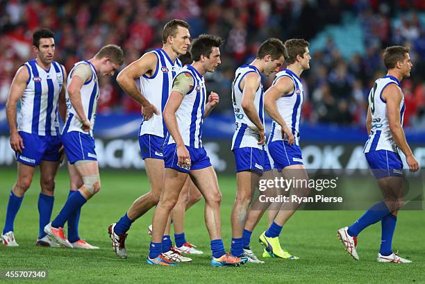 The Kangaroos look dejected after the 1st Preliminary Final AFL match between the Sydney Swans and the North Melbourne Kangaroos at ANZ Stadium on...