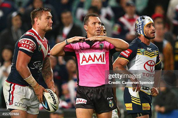 Referee Shayne Hayne calls a scrum during the 1st NRL Semi Final match between the Sydney Roosters and the North Queensland Cowboys at Allianz...