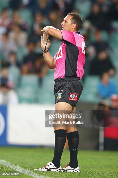 Referee Shayne Hayne calls for a video referral after a Cowboys try during the 1st NRL Semi Final match between the Sydney Roosters and the North...