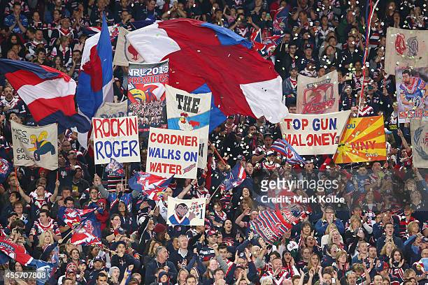 Roosters supporters cheer during the 1st NRL Semi Final match between the Sydney Roosters and the North Queensland Cowboys at Allianz Stadium on...