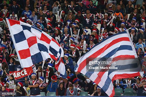 Roosters supporters cheer during the 1st NRL Semi Final match between the Sydney Roosters and the North Queensland Cowboys at Allianz Stadium on...