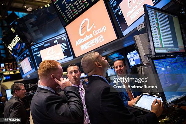 Traders work on the floor of the New York Stock Exchange prior to Alibaba Group's initial price offering on September 19, 2014 in New York City. The...