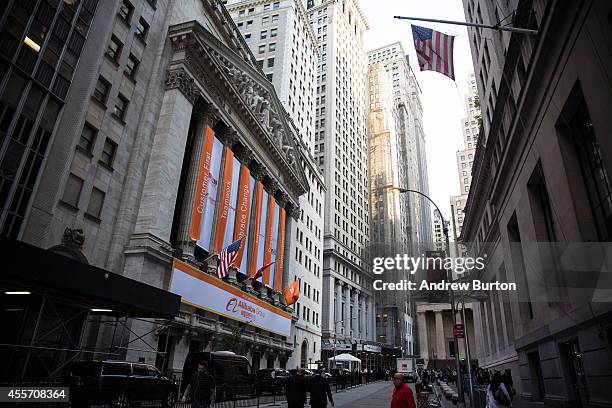 Alibaba Group signage is posted outside the New York Stock Exchange prior to the company's initial price offering on September 19, 2014 in New York...