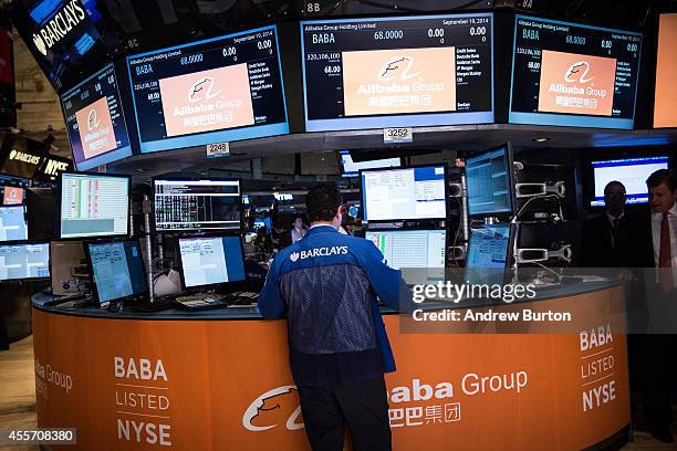 Trader works on the floor of the New York Stock Exchange prior to Alibaba Group's initial price offering on September 19, 2014 in New York City. The...