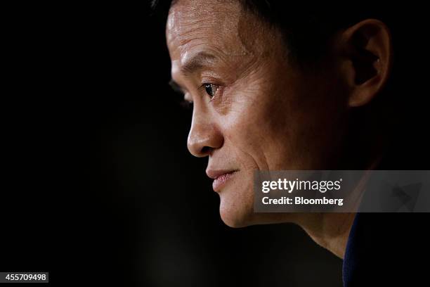 Billionaire Jack Ma, chairman of Alibaba Group Holding Ltd., listens during an interview on the floor of the New York Stock Exchange in New York,...