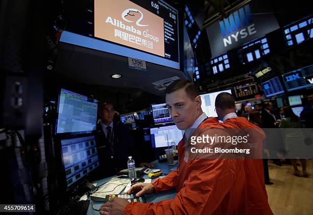 Traders work on the floor of the the New York Stock Exchange in New York, U.S., on Friday, Sept. 19, 2014. Alibaba Group Holding Ltd., the e-commerce...