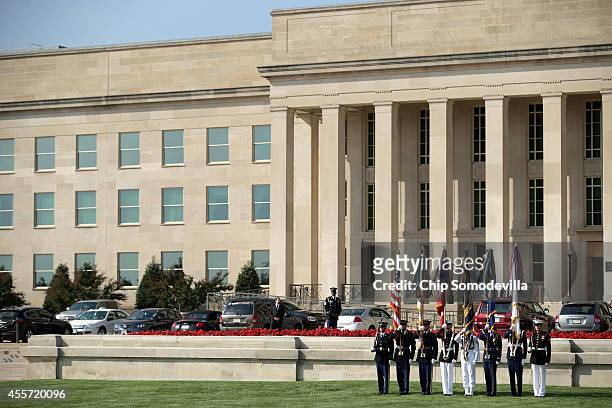 Members of a United States military honor guard prepare to march in the colors during the Defense Department's National POW/MIA Recognition Day...