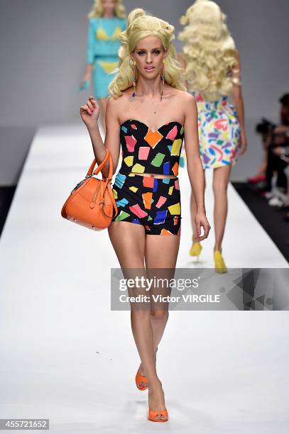 Model walks the runway during the Moschino Ready to Wear show as part of Milan Fashion Week Womenswear Spring/Summer 2015 on September 18, 2014 in...