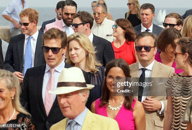 Britain's Prince Harry and Duchess of Cambridge Kate Middleton's sister Pippa arrive to attend the wedding ceremony of Charlie Gilkes and Anneke von...