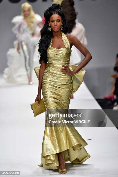 Model walks the runway during the Moschino Ready to Wear show as part of Milan Fashion Week Womenswear Spring/Summer 2015 on September 18, 2014 in...