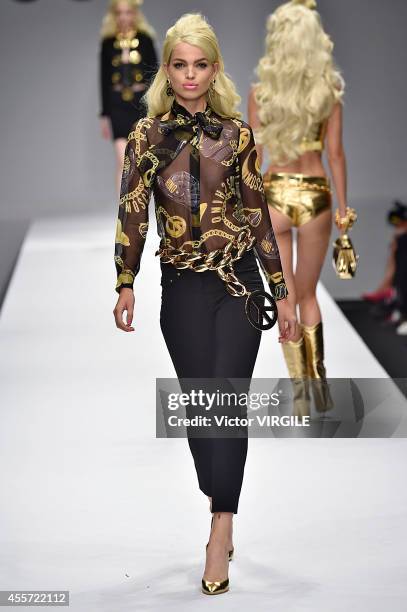 Model walks the runway during the Moschino Ready to Wear show as part of Milan Fashion Week Womenswear Spring/Summer 2015 on September 18, 2014 in...