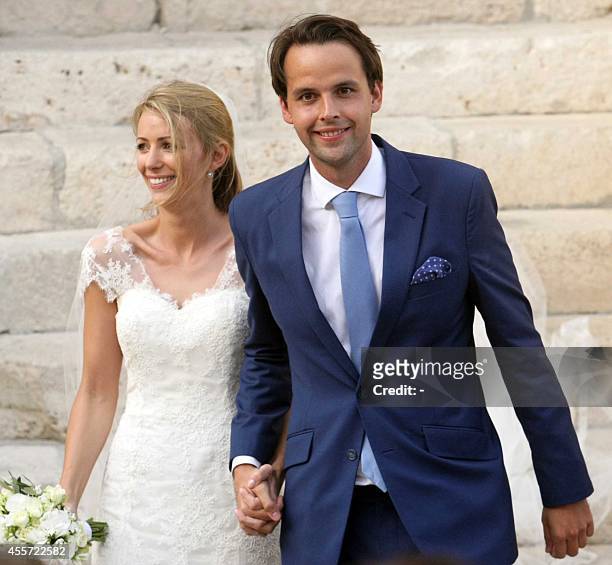 Charlie Gilkes , a British nightclub owner, and Anneke von Trotha Taylor smile at the end of their wedding at Carlo V Castle of Monopoli, on...