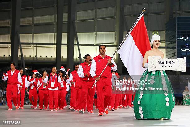 Flag bearer, Gede Siman Sudartawa of Indonesia arrives during the Opening Ceremony ahead of the 2014 Asian Games at Incheon Asiad Main Stadium on...