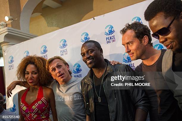 Aymen , Peace One Day founder Jeremy Gilley , US Hip hop star Akon , British actor Jude Law and Congoles musician Lexxus Legal pose after a press...
