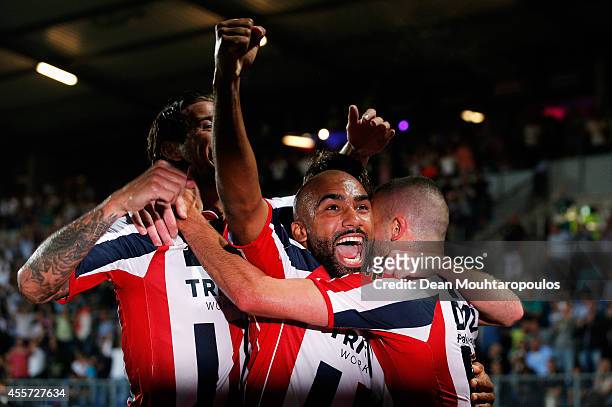 Ben Sahar of Willem II celebrates scoring the first goal of the game with team mates Samuel Armenteros during the Dutch Eredivisie match between...