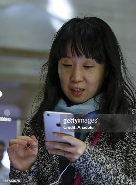 One of the first customers at the Fifth Avenue Apple store try out the new iPhone 6 in New York, United States on 19 September 2014. The new iPhone 6...