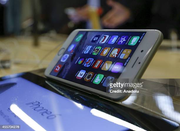 Some of the first customers at the Fifth Avenue Apple store try out the new iPhone 6 in New York, United States on 19 September 2014. The new iPhone...