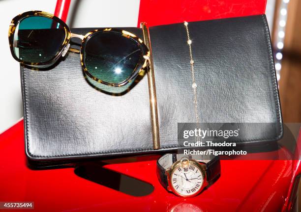 Journalist Anne Sophie Lapix's style inspirations are photographed for Madame Figaro on April 1, 2014 in Paris, France. Sunglasses , clutch , watch...