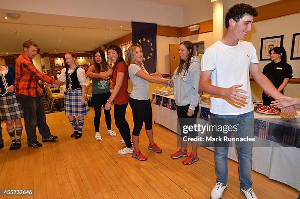 Team Europe and Team USA join together for traditional Ceilidh dancing at the Angus Hotel during the 2014 Junior Ryder Cup - Previews on September...