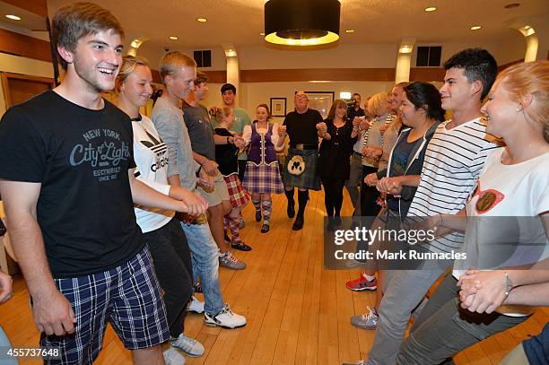 Team Europe and Team USA join together for traditional Ceilidh dancing at the Angus Hotel during the 2014 Junior Ryder Cup - Previews on September...