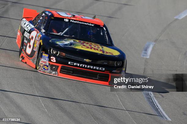 Ty Dillon, driver of the Bass Pro Shops Chevrolet, practices for the NASCAR Nationwide Series VisitMyrtleBeach.com 300 at Kentucky Speedway on...