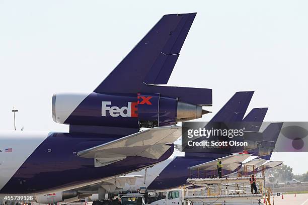 FedEx jets sit at the company's facility at O'Hare International Airport on September 19, 2014 in Chicago, Illinois. In 2013, 67 million passengers...
