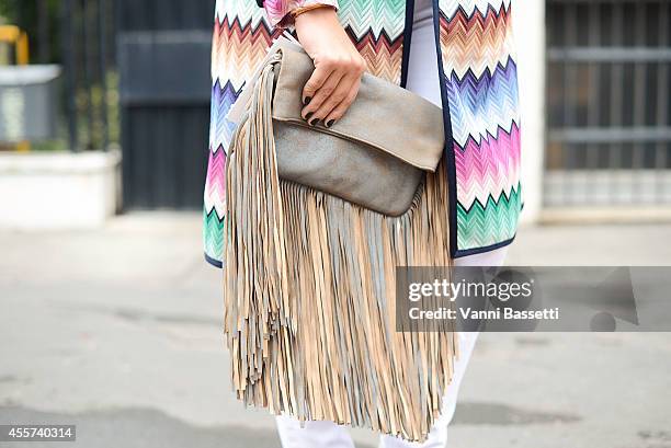 Buse Terim wears a Missoni coat, J brand trousers and Barbara Bonner bag on September 19, 2014 in Milan, Italy.