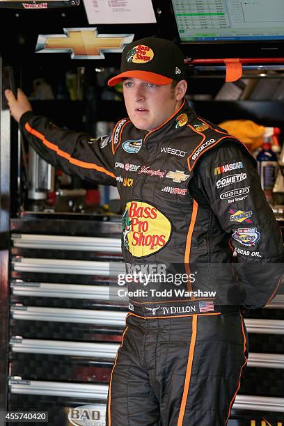 Ty Dillon, driver of the Bass Pro Shops Chevrolet, stands in the garage area during practice for the NASCAR Nationwide Series VisitMyrtleBeach.com...