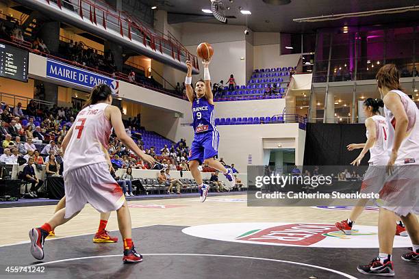 Celine Dumerc of the French Basketball Women's National Team shoots a three point during the game between France and China at Stade Pierre de...