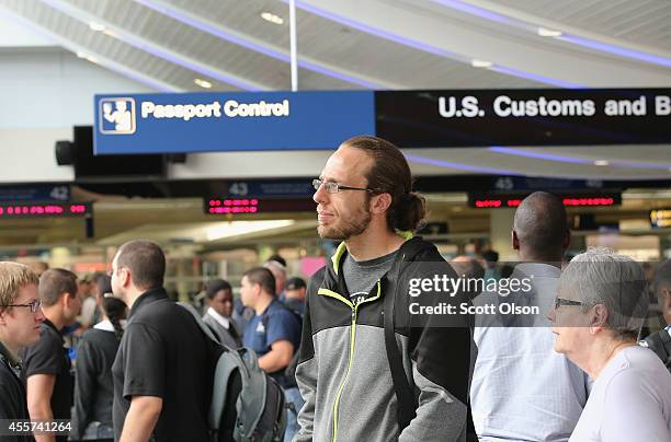 International travelers wait to have their passports checked at O'Hare International Airport on September 19, 2014 in Chicago, Illinois. OHare is the...