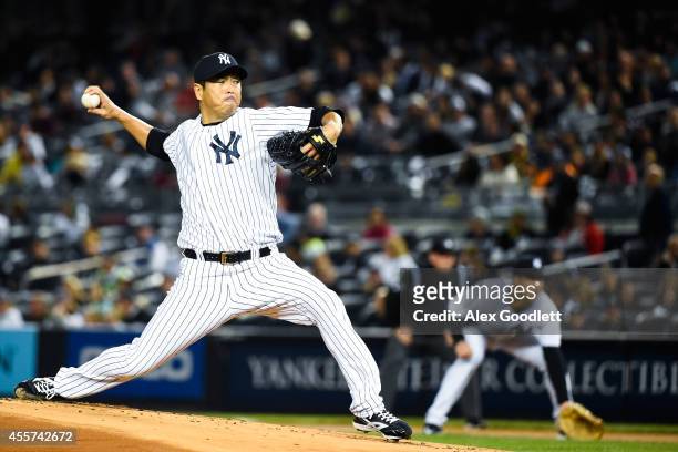 Hiroki Kuroda of the New York Yankees throws a pitch in the first inning against the Toronto Blue Jays at Yankee Stadium on September 19, 2014 in the...