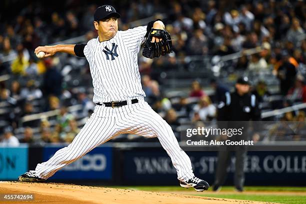 Hiroki Kuroda of the New York Yankees throws a pitch in the first inning against the Toronto Blue Jays at Yankee Stadium on September 19, 2014 in the...