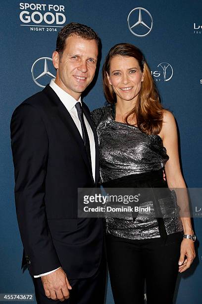 Oliver Bierhoff and Klara Szalantzy attend the Laureus Sport for Good Night 2014 at Bayerischer Hof on September 19, 2014 in Munich, Germany.