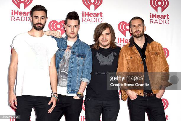 Recording artists Kyle J. Simmons, Dan Smith, Chris 'Woody' Wood and William Farquarson of the band Bastille attend night 1 of the 2014 iHeartRadio...