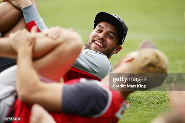 Lance Franklin of the Swans stretches during a Sydney Swans AFL recovery session at the Sydney Cricket Ground on September 20, 2014 in Sydney,...