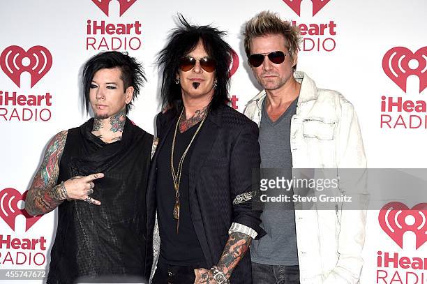 Musicians DJ Ashba, Nikki Sixx and James Michael of Sixx:A.M. Attend night 1 of the 2014 iHeartRadio Music Festival at MGM Grand Garden Arena on...