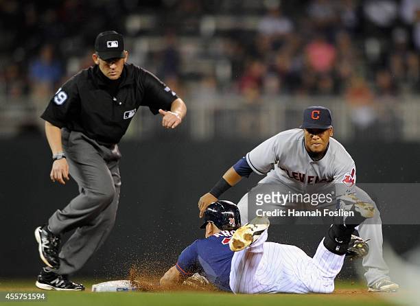 Oswaldo Arcia of the Minnesota Twins is out at second base as Jose Ramirez of the Cleveland Indians fields the ball during the fifth inning of the...