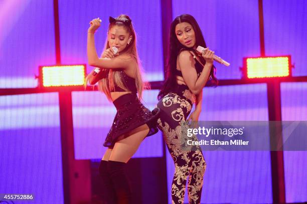 Recording artists Ariana Grande and Nicki Minaj perform onstage during the 2014 iHeartRadio Music Festival at the MGM Grand Garden Arena on September...