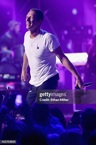 Frontman Chris Martin of Coldplay performs onstage during the 2014 iHeartRadio Music Festival at the MGM Grand Garden Arena on September 19, 2014 in...