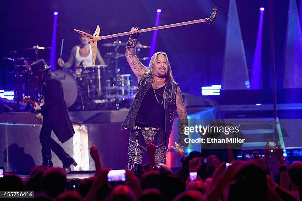 Guitarist Mick Mars, drummer Tommy Lee and singer Vince Neil of Motley Crue perform onstage during the 2014 iHeartRadio Music Festival at the MGM...