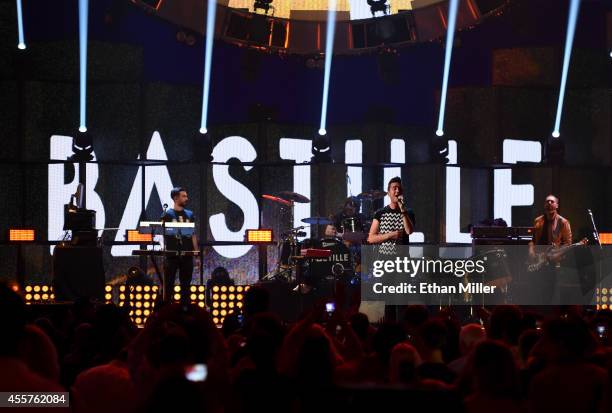 Keyboardist Kyle Simmons, drummer Chris "Woody" Wood, frontman Dan Smith and bassist Will Farquarson of Bastille perform onstage during the 2014...