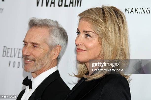 Actress Sharon Stone and guest attend the 2013 amfAR Inspiration Gala Los Angeles presented by MAC Viva Glam at Milk Studios on December 12, 2013 in...