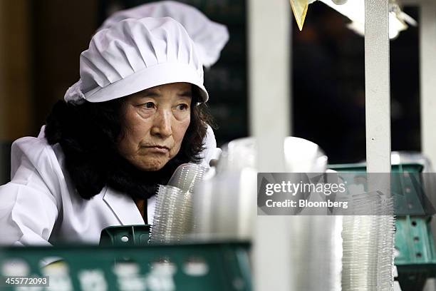 Worker packs strawberries at a packing warehouse, operated by the National Agricultural Cooperative Federation , in Nonsan, South Chungcheong...