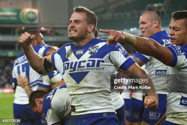 Josh Reynolds of the Bulldogs celebrate victory after Trent Hodkinson kicked the winning field goal in extra time golden point during the NRL 2nd...