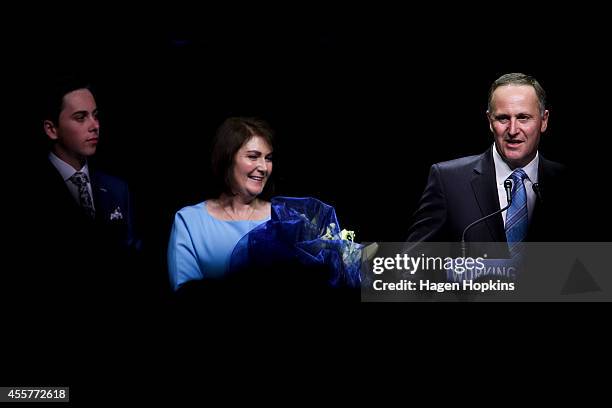 Newly elected Prime Minister John Key delivers his victory speech while party son Max Key and wife Bronagh Key look on at Viaduct Events Centre on...