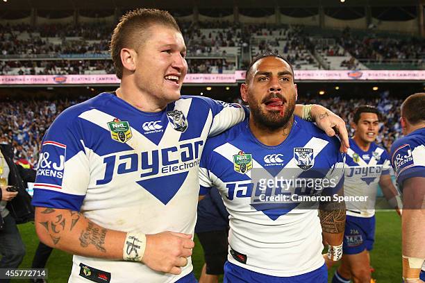 Greg Eastwood of the Bulldogs and team mate Reni Maitua celebrate after winning the NRL 2nd Semi Final match between the Manly Sea Eagles and the...