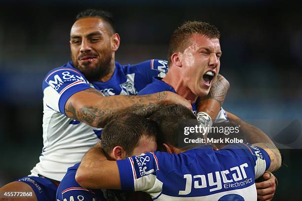 Reni Maitua and Trent Hodkinson of the Bulldogs celebrate victory after Trent Hodkinson kicked the winning field goal in extra time golden point...