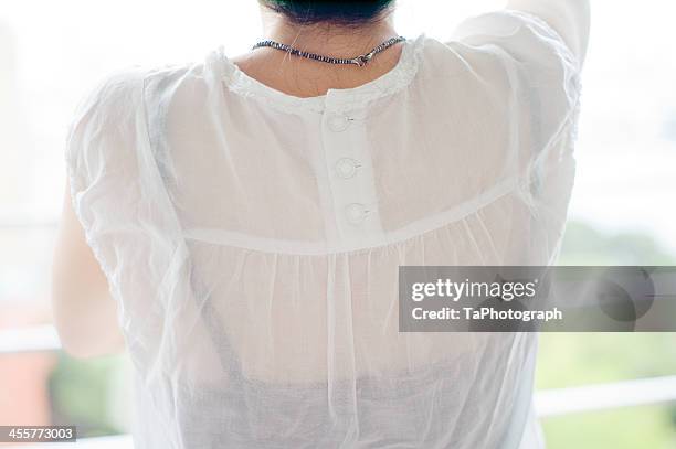 woman in white blouse - transparent blouse stock pictures, royalty-free photos & images